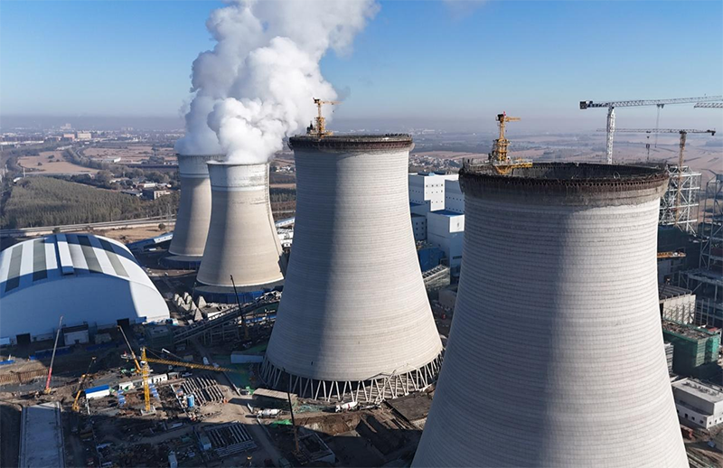 筑顶冰城暖源!国能哈热二期项目3号排烟冷却塔顺利封顶